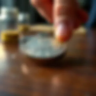 A close-up of a 1937 US coin resting on a wooden table, with a man's hand reaching towards it for inspection.