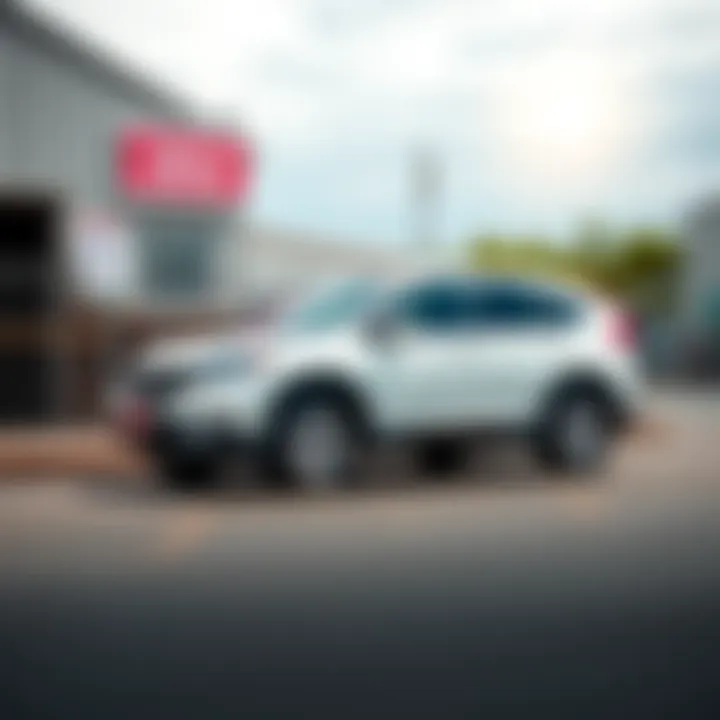 A 2014 Honda CRV parked outside an auction site, showcasing its clean exterior and shiny wheels, with a sign indicating it was sold for $2300.