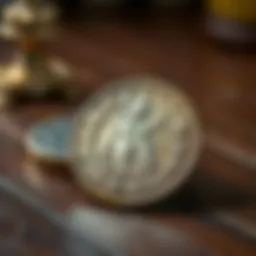 A close-up of an antique coin showing its details and silver sheen, placed on a wooden table.