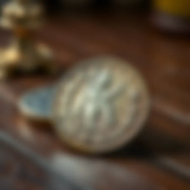 Antique Coin with Silver Content A close-up of an antique coin showing its details and silver sheen, placed on a wooden table.