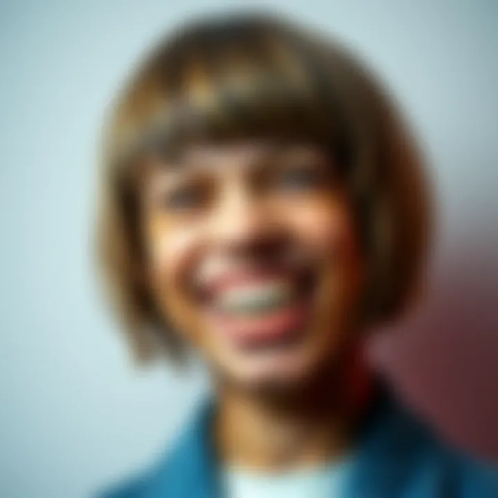A person with a bowl cut hairstyle and prominent turkey teeth, smiling playfully.