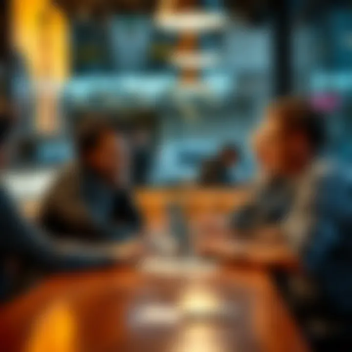 A group of people discussing a controversial term on their laptops at a cafe