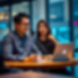 A 31-year-old IT professional and their Indonesian spouse sitting at a table with a laptop, exploring passive business opportunities in Indonesia.