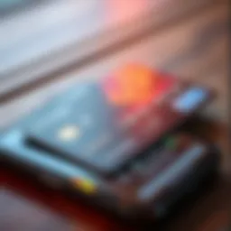 A close-up view of a crypto debit card placed on a smartphone displaying crypto values, symbolizing 1 USDC to 1 USD exchange rates.