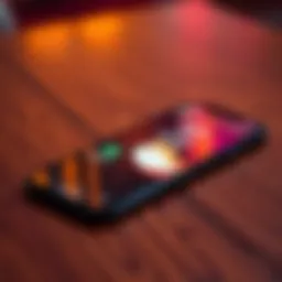 A Dogecoin Card placed on a wooden table next to a smartphone displaying the Robinhood app
