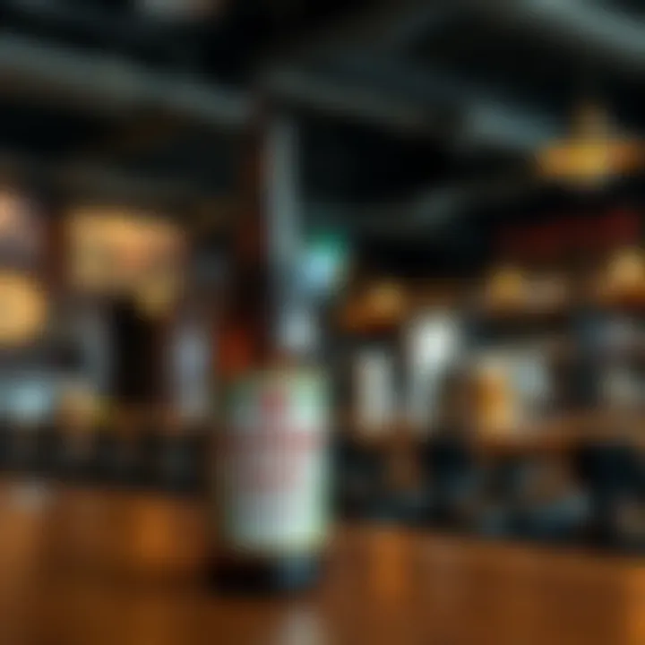 A bottle of Kendu Tripel Beer with a label showcasing community initiative, set on a wooden table with a blurred background of a pub