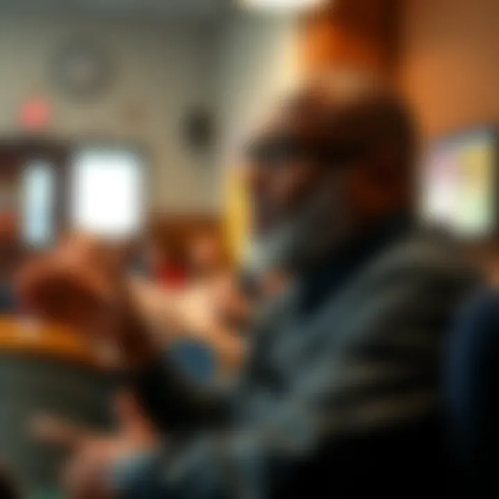 A local leader speaking at a community meeting about plans to buy the neighborhood.