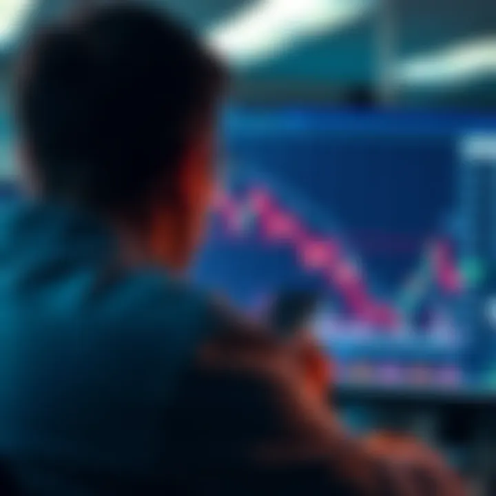 A person looking worriedly at a stock market chart showing a downward trend on a computer screen.