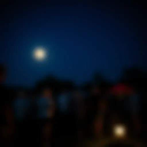 People gather outdoors at night to watch the moon during community moon viewing event in Ohio.