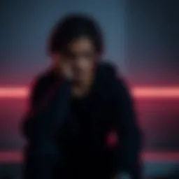 Individual with a pained expression sitting alone, reflecting on a recent disappointment