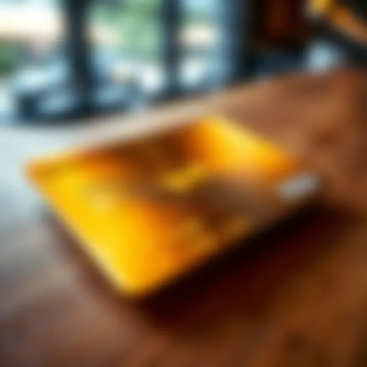 A close-up view of the Revolut Radial Gold card placed on a wooden table, showcasing its shiny finish and unique design.