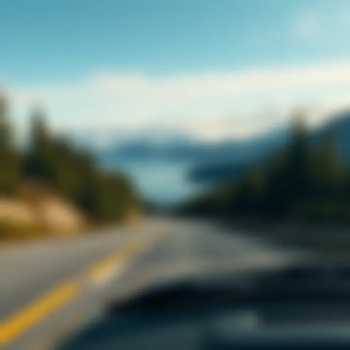 A scenic view of a car driving along a coastal highway with mountains in the distance and trees lining the road