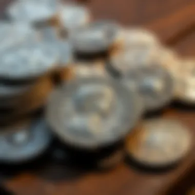 A display of Roman silver denarii and an Antoninianus of Gordian on a wooden table.