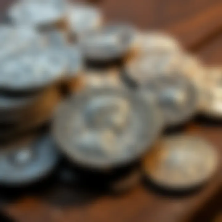 A display of Roman silver denarii and an Antoninianus of Gordian on a wooden table.
