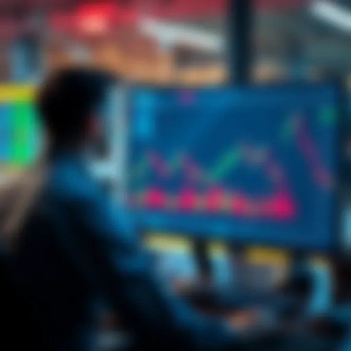 A person looking at stock charts on a computer while a graph with a downward trend for cryptocurrency is on the screen.