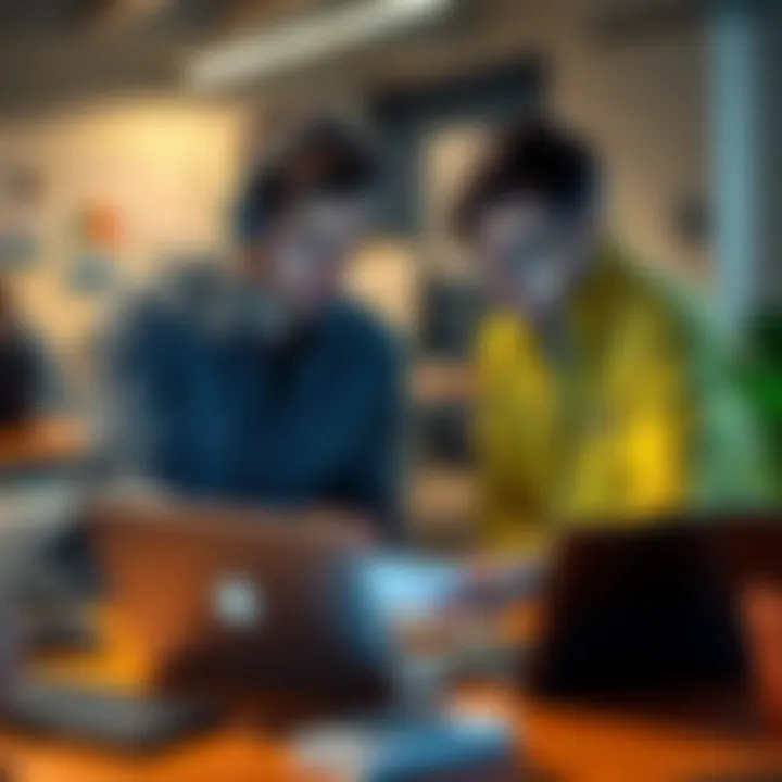 Two tech enthusiasts discussing a project with laptops and notes in a workspace