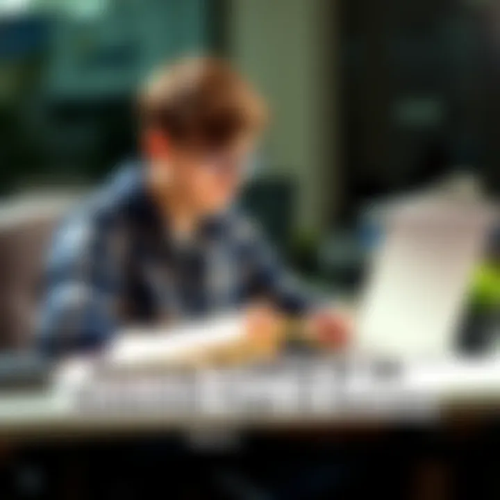 A young person studying trading strategies with books and a laptop on a desk.